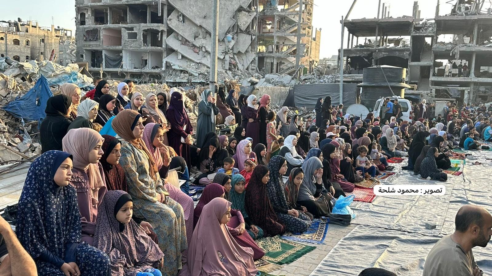 Gazans listening to the Eid Khutbah given by the Imam amidst the ruins of Gaza